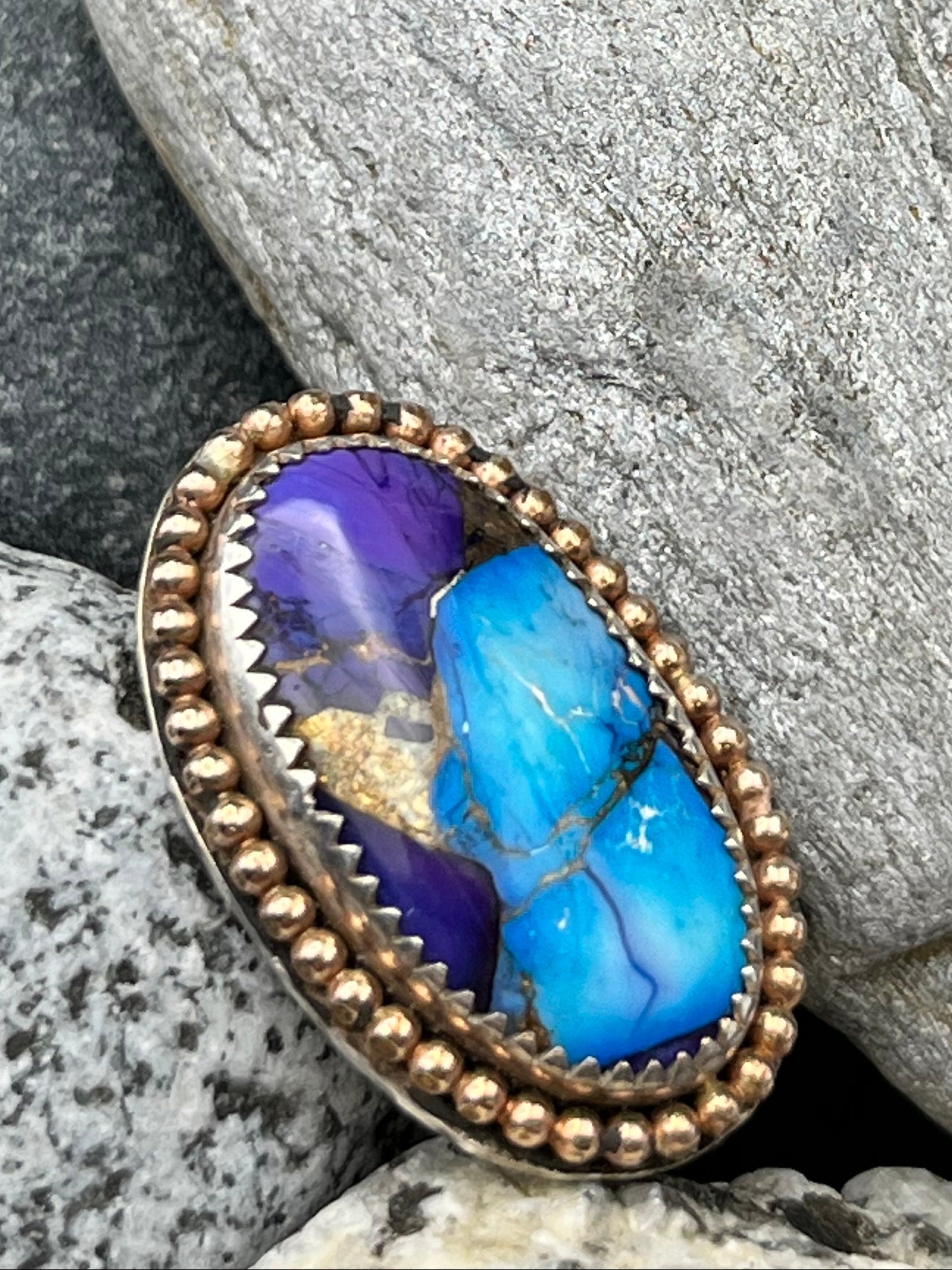 Blue stone ring on a rock